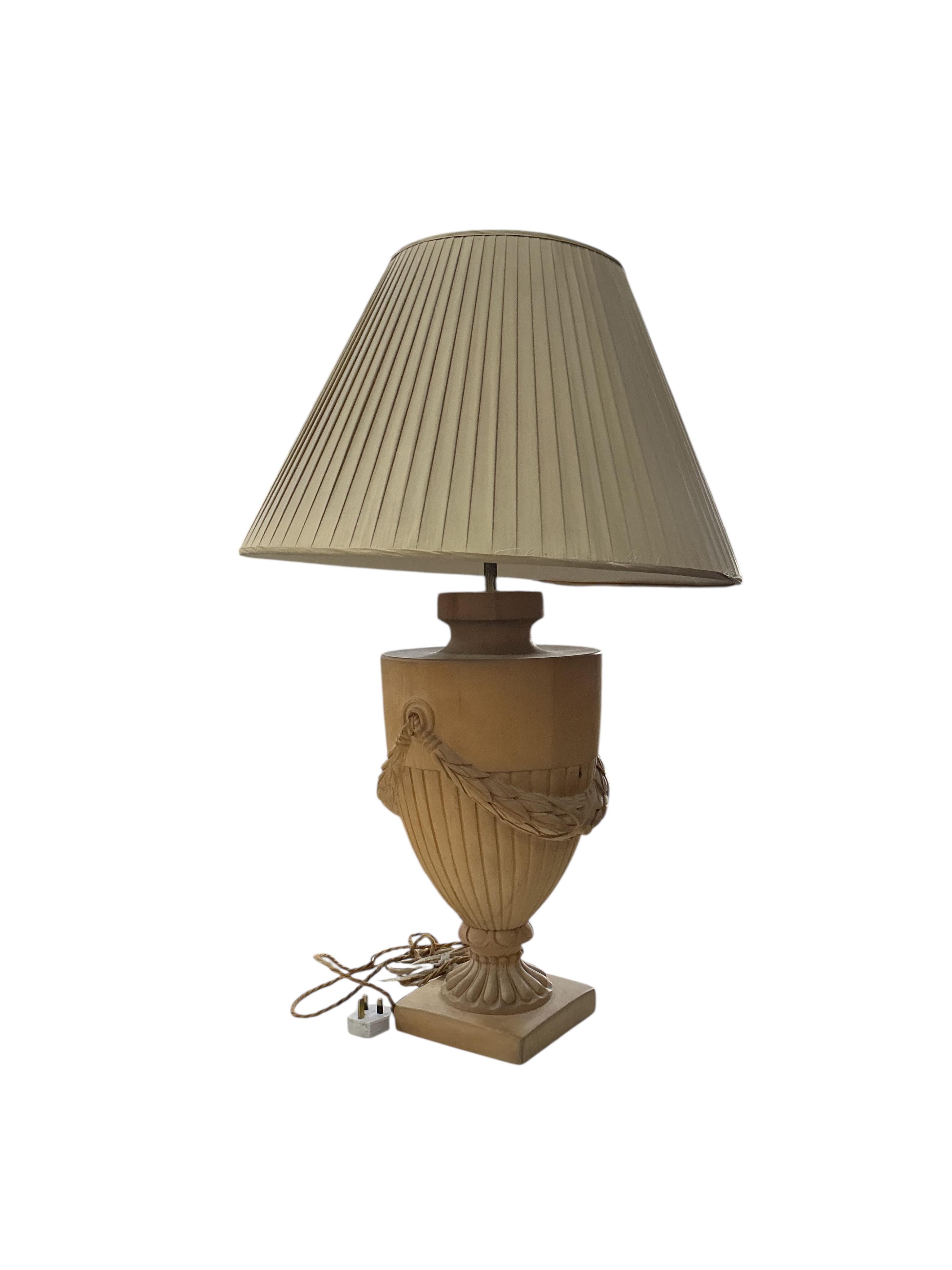 A pair of beech campana urn shaped lamps with shades, height including shades 90cm, Provenance: The late Kenneth Turner (1936-2025), celebrity florist, designer and perfume retailer, he received the Royal Warrant from th